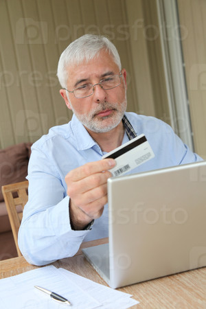 Senior man doing online shopping