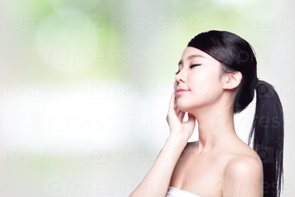 Beautiful Skin care woman Face smile and enjoy carefree isolated on nature green background. asian Beauty