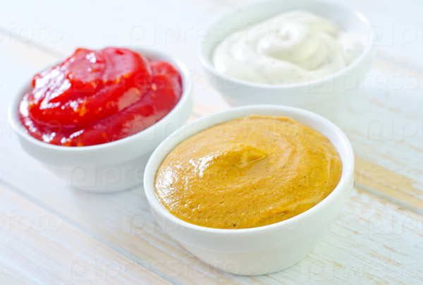 bowls with ketchup, mustard, and mayonnaise