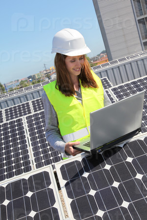 Woman engineer on solar panels site