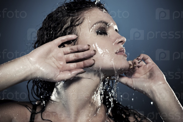 Water flowing on woman face