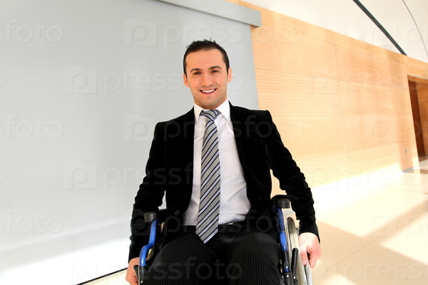 Businessman in wheelchair going to attend congress meeting