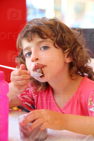 Girl eating chocolate ice cream dirty face