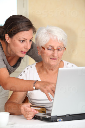 Elderly woman and young woman shopping on internet