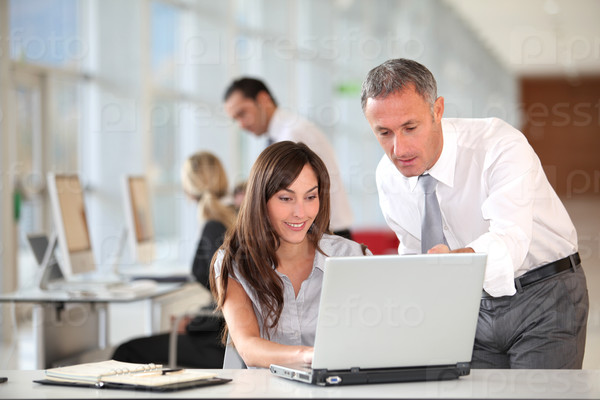 Manager and secretary working in the office