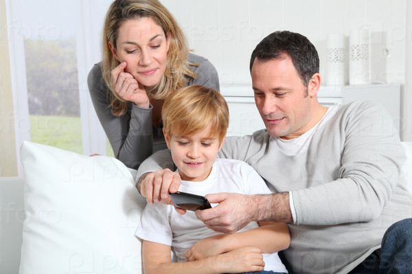 Family playing video game on smart phone