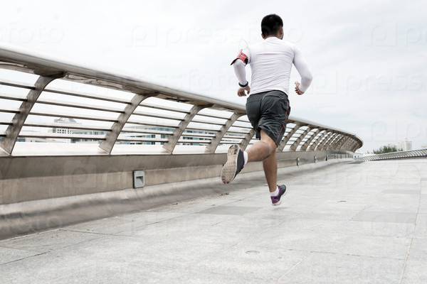 Healthy lifestyle concept: sportsman jogging outdoors in the morning