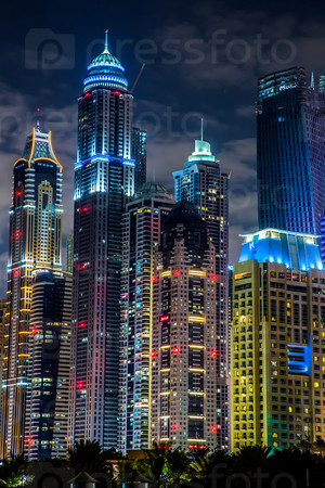 DUBAI, UAE - NOVEMBER 13: Dubai downtown night scene with city lights, luxury new high tech town in United Arab Emirates architecture  on November 13, 2012 in Dubai, UAE. Dubai Marina cityscape, UAE