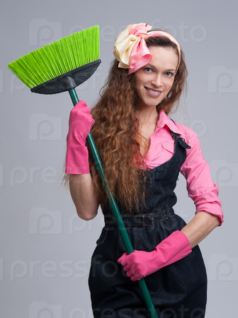 young woman with broom