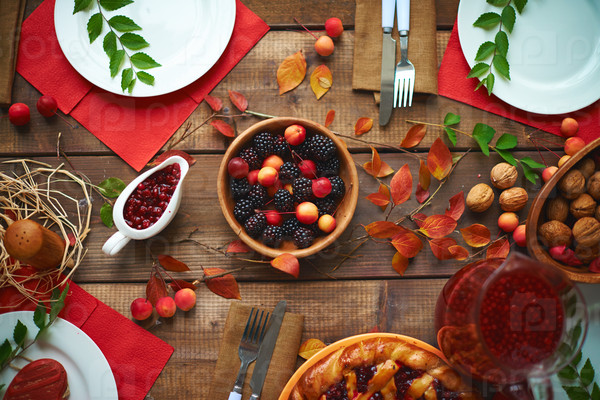 High angle view of rustic dinner table with berries