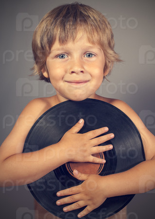 boy with a record smiles