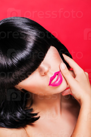 beautiful make up of glamour pink gloss lips. model in black wig