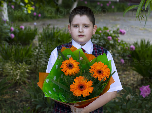 the school student with a beautiful bouquet of flowers, the front view