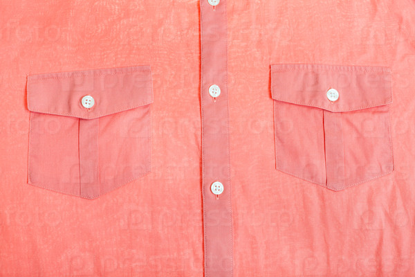 pockets and buttons of red shirt close up