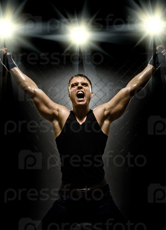 photo  muscular young  guy street-fighter,  triumphant cries  yell , hard light