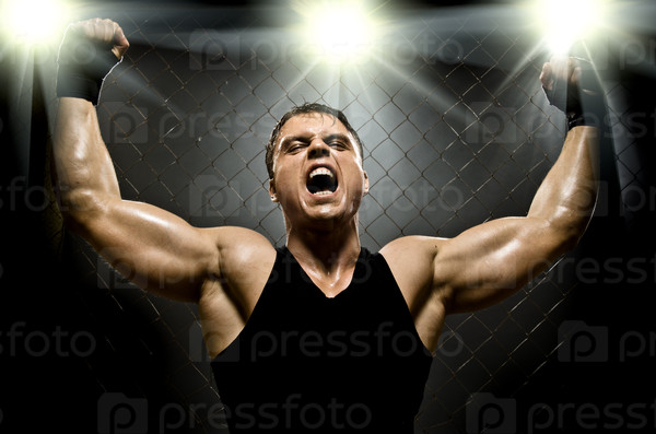 photo  muscular young  guy street-fighter,  triumphant cries  yell , hard light