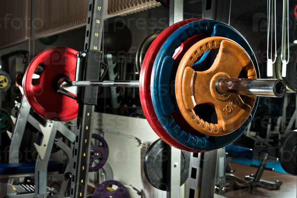 weight in dark weight room, horizontal photo