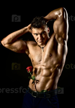 the very muscular handsome sexy guy on black background,\
naked torso
