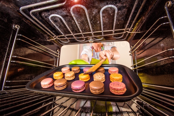 Baking macarons in the oven view from the inside of the oven. Cooking in the oven, stock photo