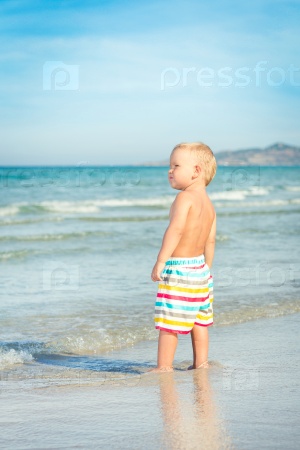 Baby looking sea on the beach