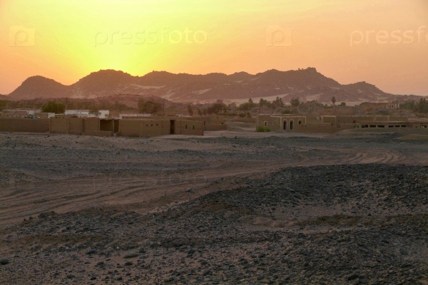 Sunset in the Sahara Desert. City in the desert.