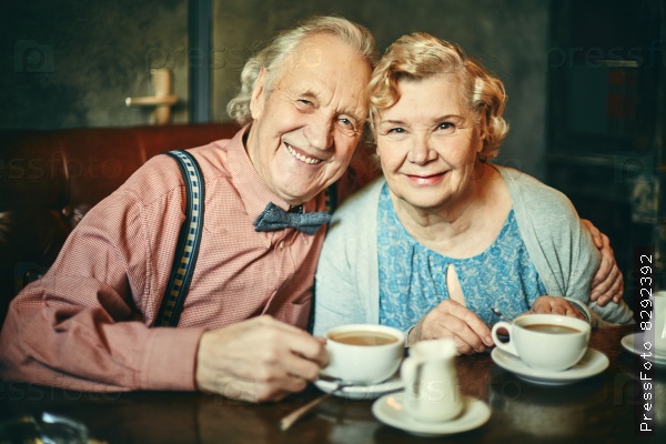 Happy seniors in cafe
