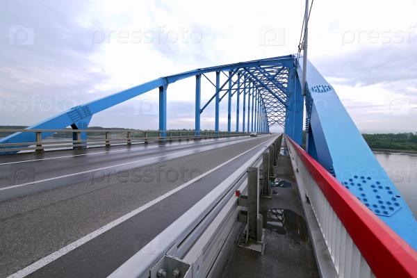 Krasnoyarsk, Eastern Siberia - 15 August 2012: the Bridge over the Yenisei river, the road of the M5. The Yenisei river under the bridge.
