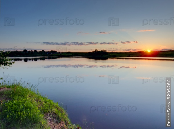 Summer sunset on a lake. Ruza reservoir in Russia.