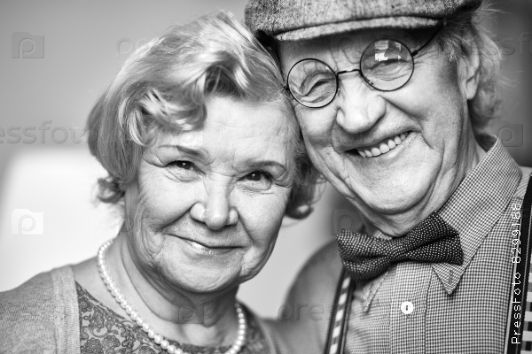 Retired couple looking at camera