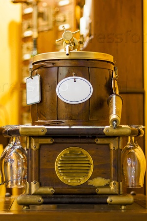 wooden barrel for alcoholic drinks with glasses in retro style
