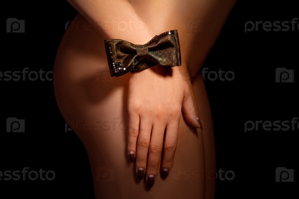 The woman hand with a bow tie
