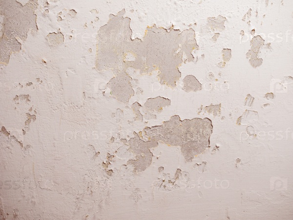 Vintage looking Damage caused by damp and moisture on a wall