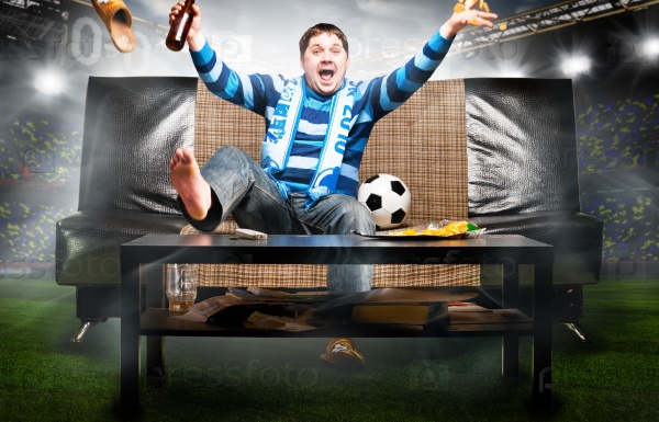 Soccer fan on sofa
