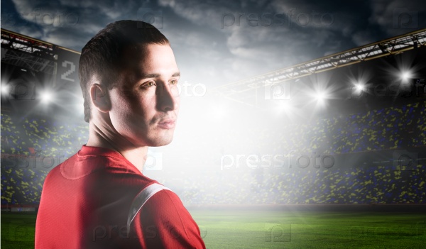 soccer or football player on stadium is looking back