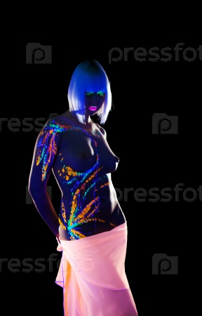 Sexy topless young woman posing with UV makeup