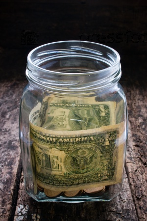 donations to help those in need of money in a glass jar