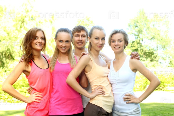 Young happy caucasian friends in a fitness wear outdoors