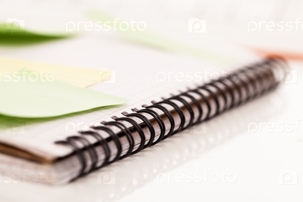 Postit papers attached to a squared notebook