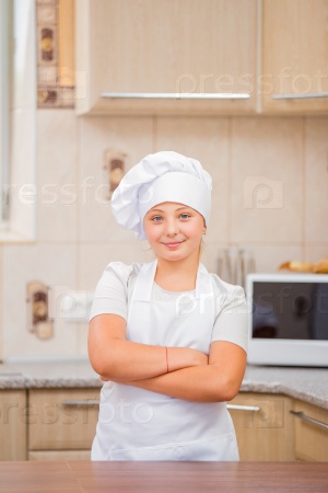 Girl chef in the kitchen
