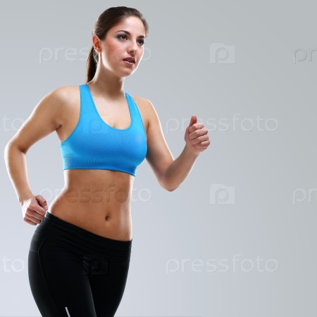Young beautiful woman in fitness wear