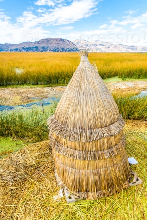 Floating  Islands on Lake Titicaca Puno, Peru, South America,thatched home. Dense root that plants interweave form natural layer called Khili about one to two meters thick that support islands