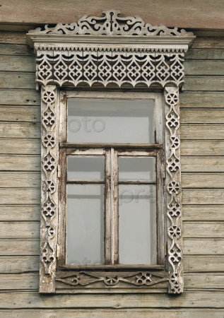 Window of an old russian house decorated with carving
