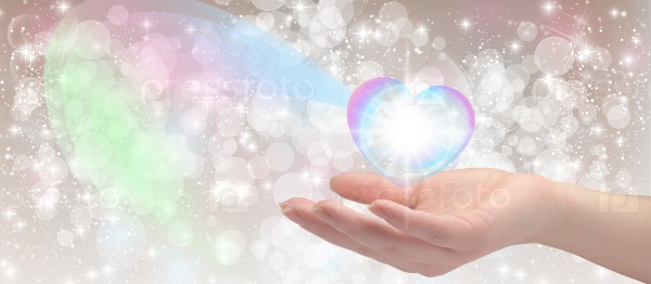 Healing hands on sparkling bokeh background, stock photo