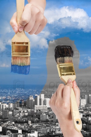 paintbrush paints black and blue side of city
