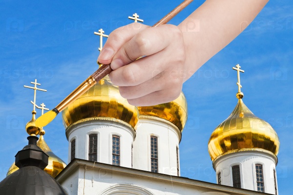 painbrush paints golden cupola on russian church