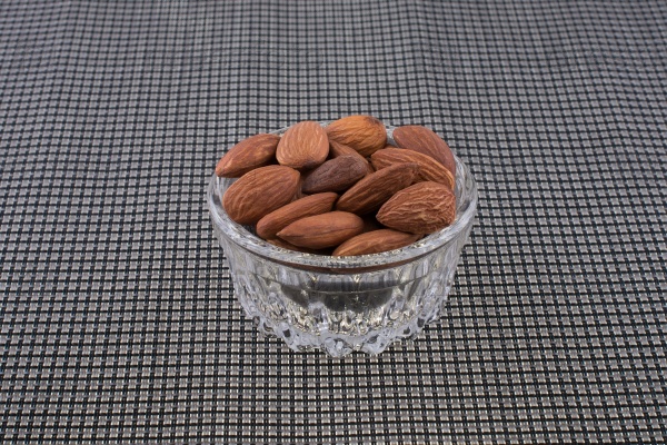 Almond fruit piled in a heap cup