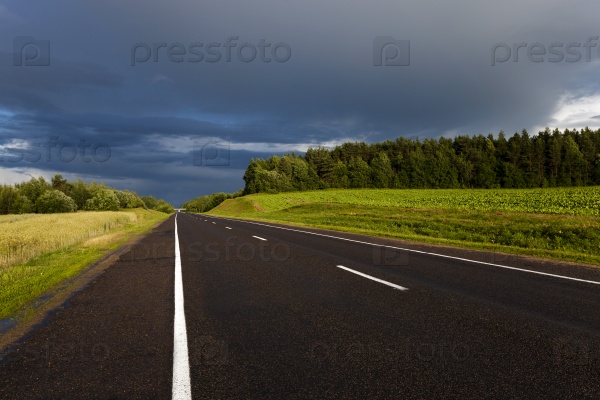 the highway in storm, thunderstorm weather. Belarus