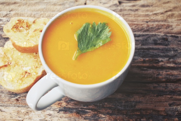 Pumpkin soup with garlic and herb bread