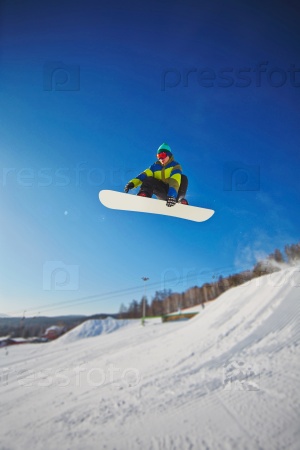 Extreme sport lover spending winter vacation at snowboarding resort