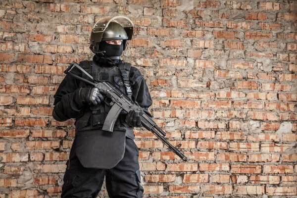 Special forces operator in black uniform and bulletproof , stock photo